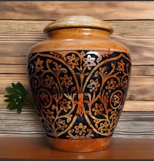 Decorative wooden urn with intricate floral pattern